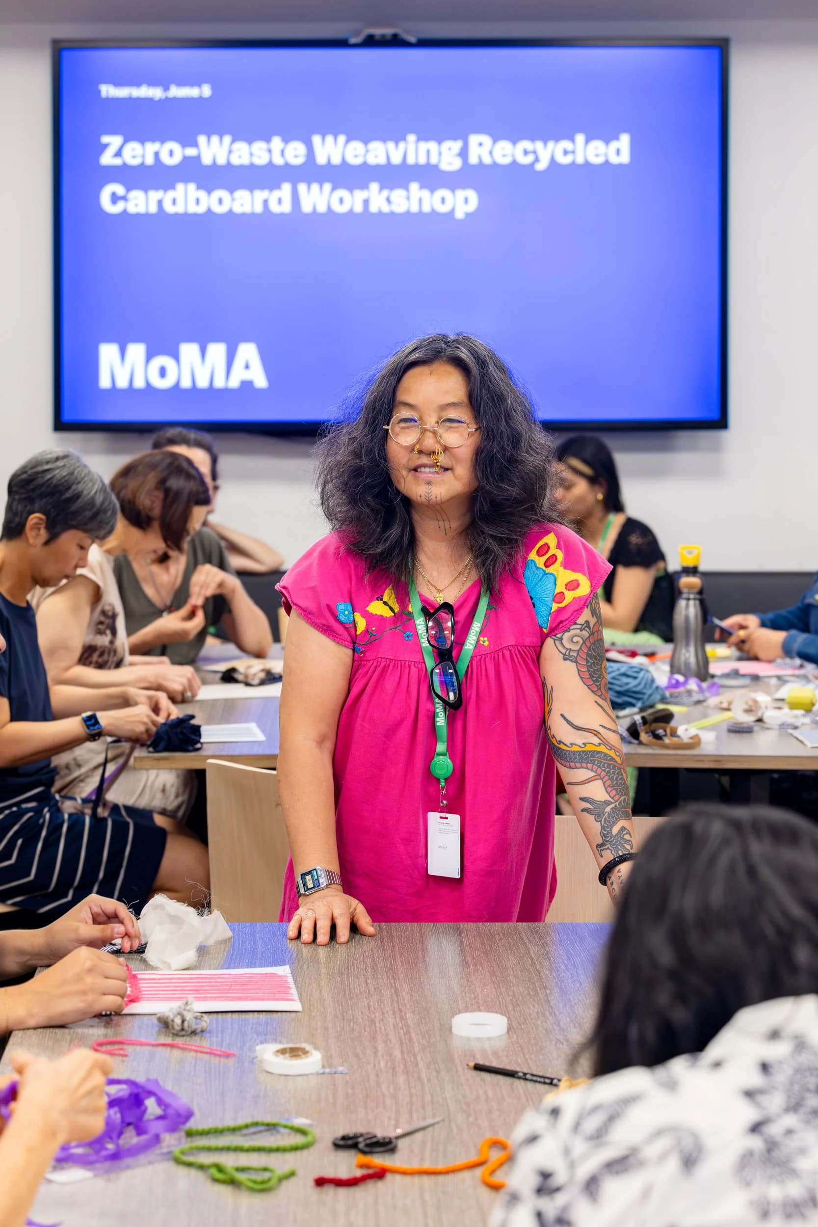 Cynthia Alberto leading a Zero-Waste Weaving Recycled Cardboard Workshop at MoMA
