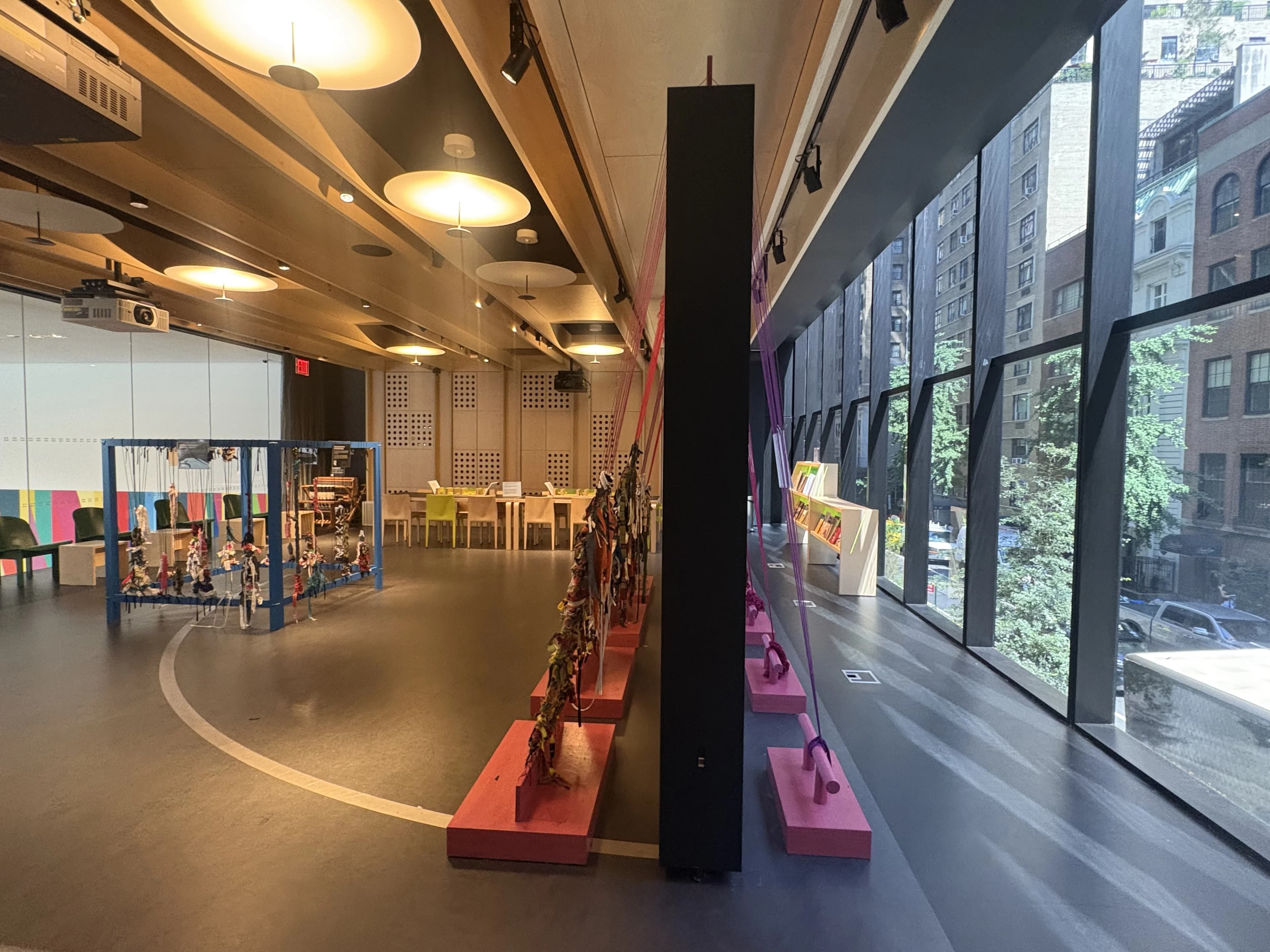 Large-scale woven installation stretched across the studio floor