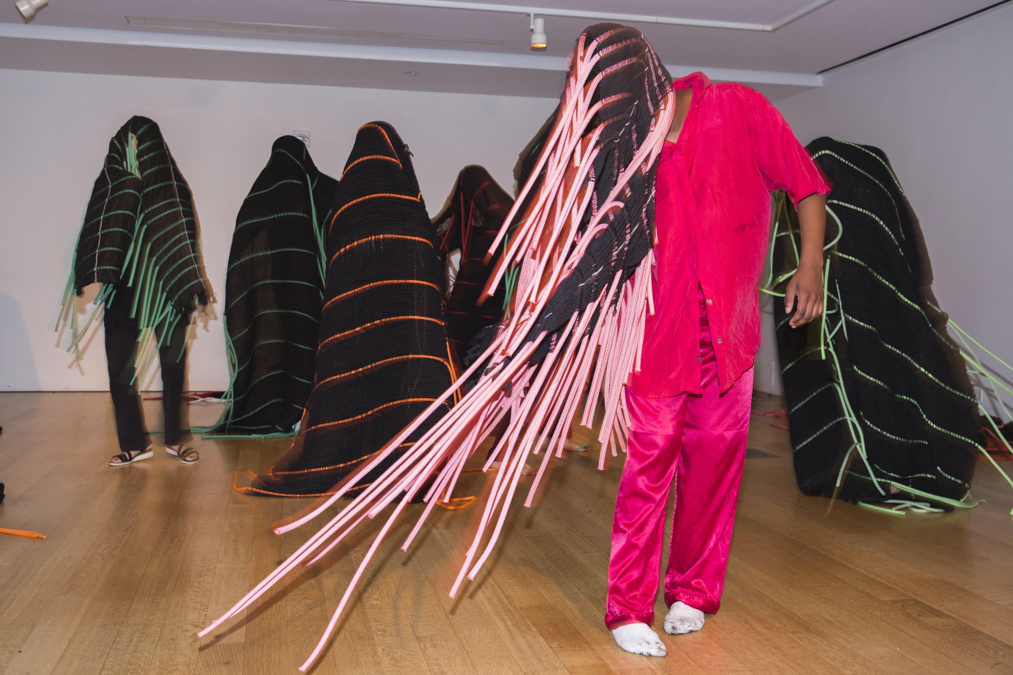 TechnoLove dancers moving together in woven forms