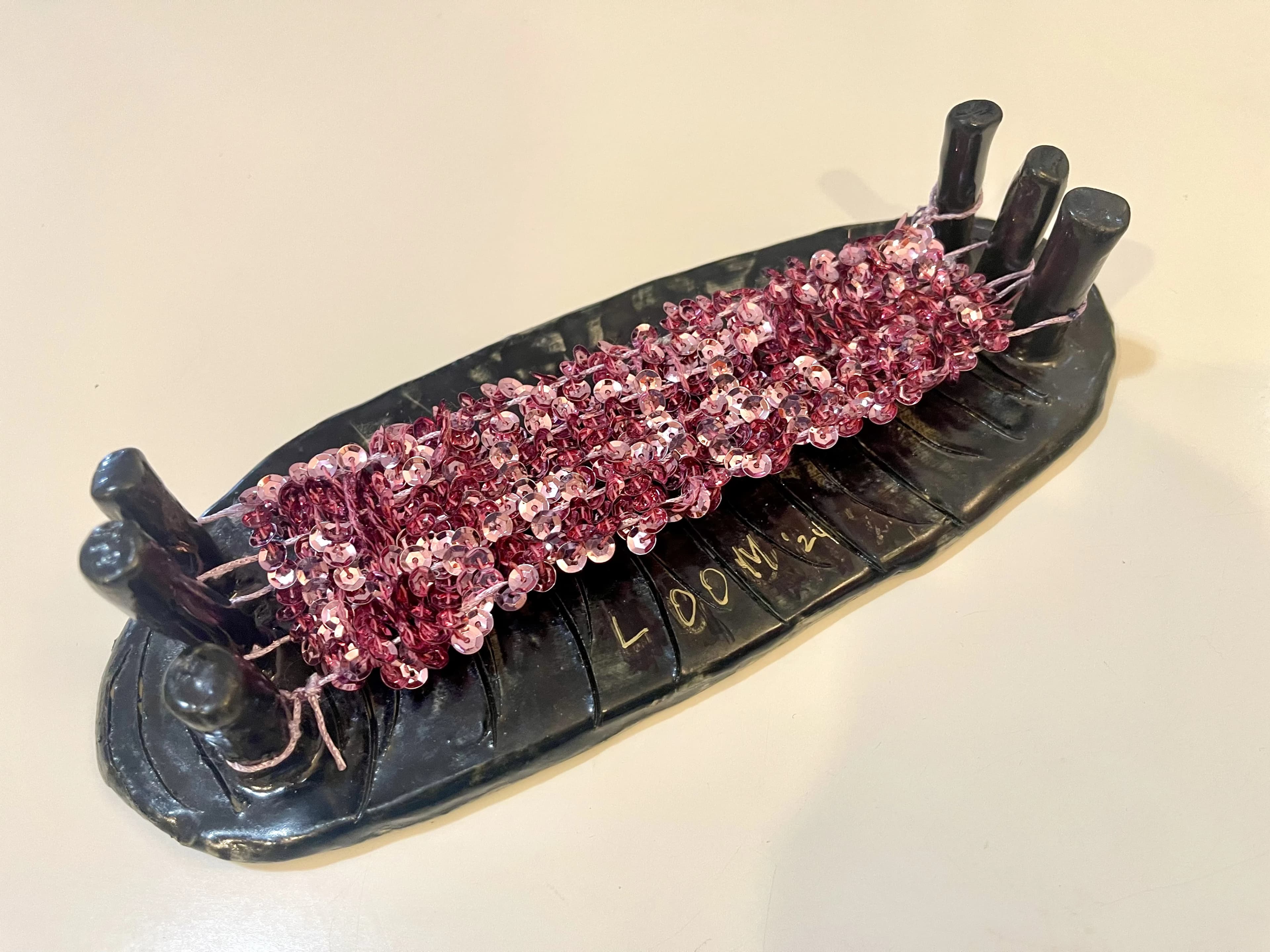 Clay Looms sculpture combining ceramic and woven elements