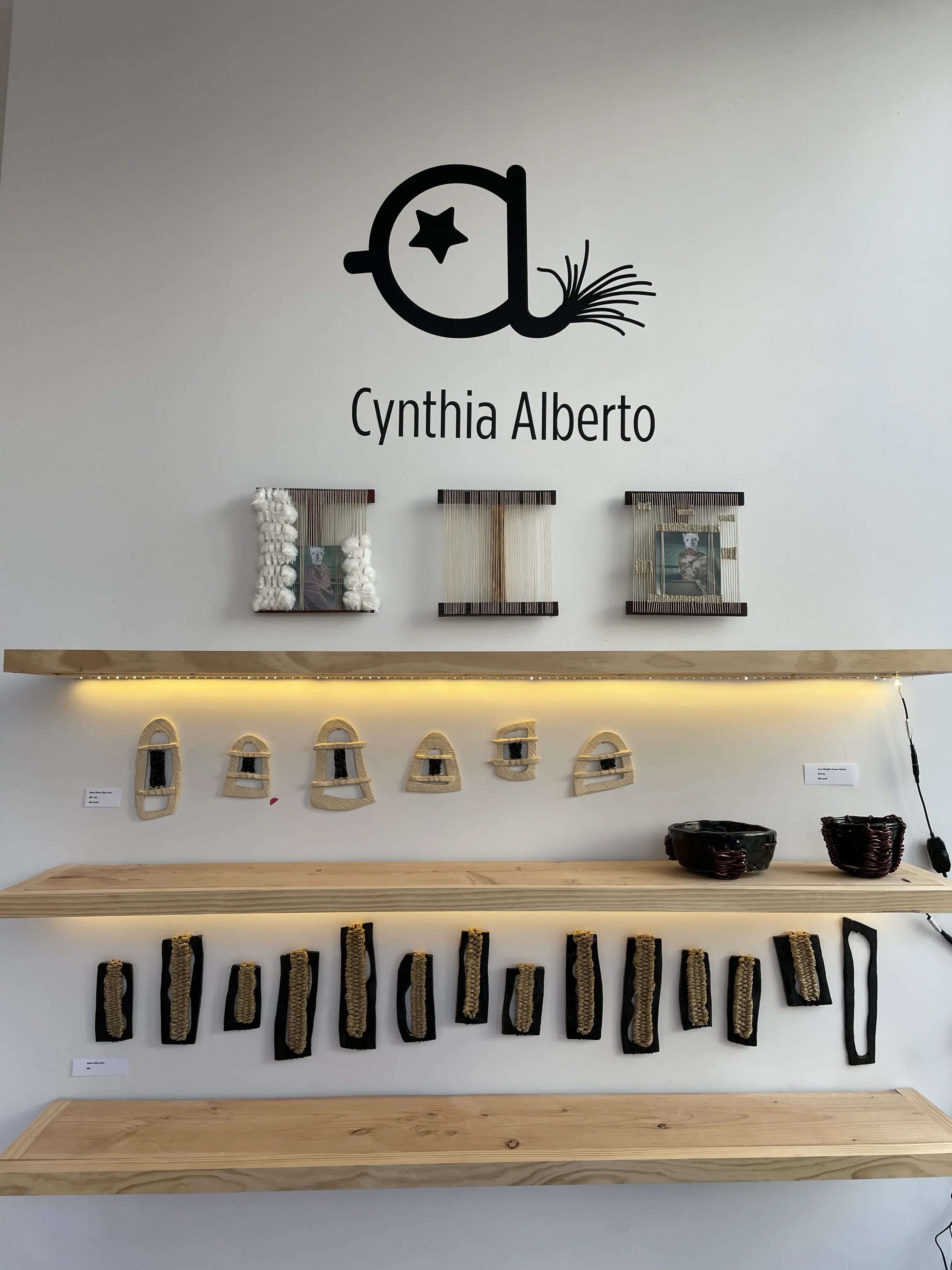 Clay Looms tall sculpture with ceramic pendants