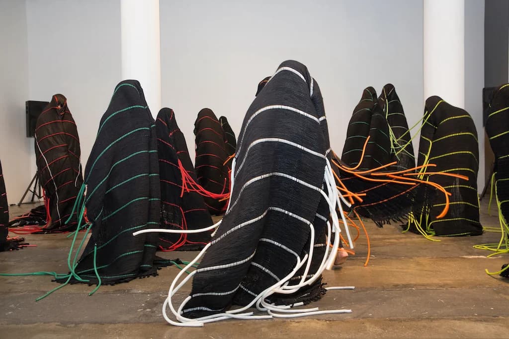 TechnoLove dancer unfurling from fiber cocoon