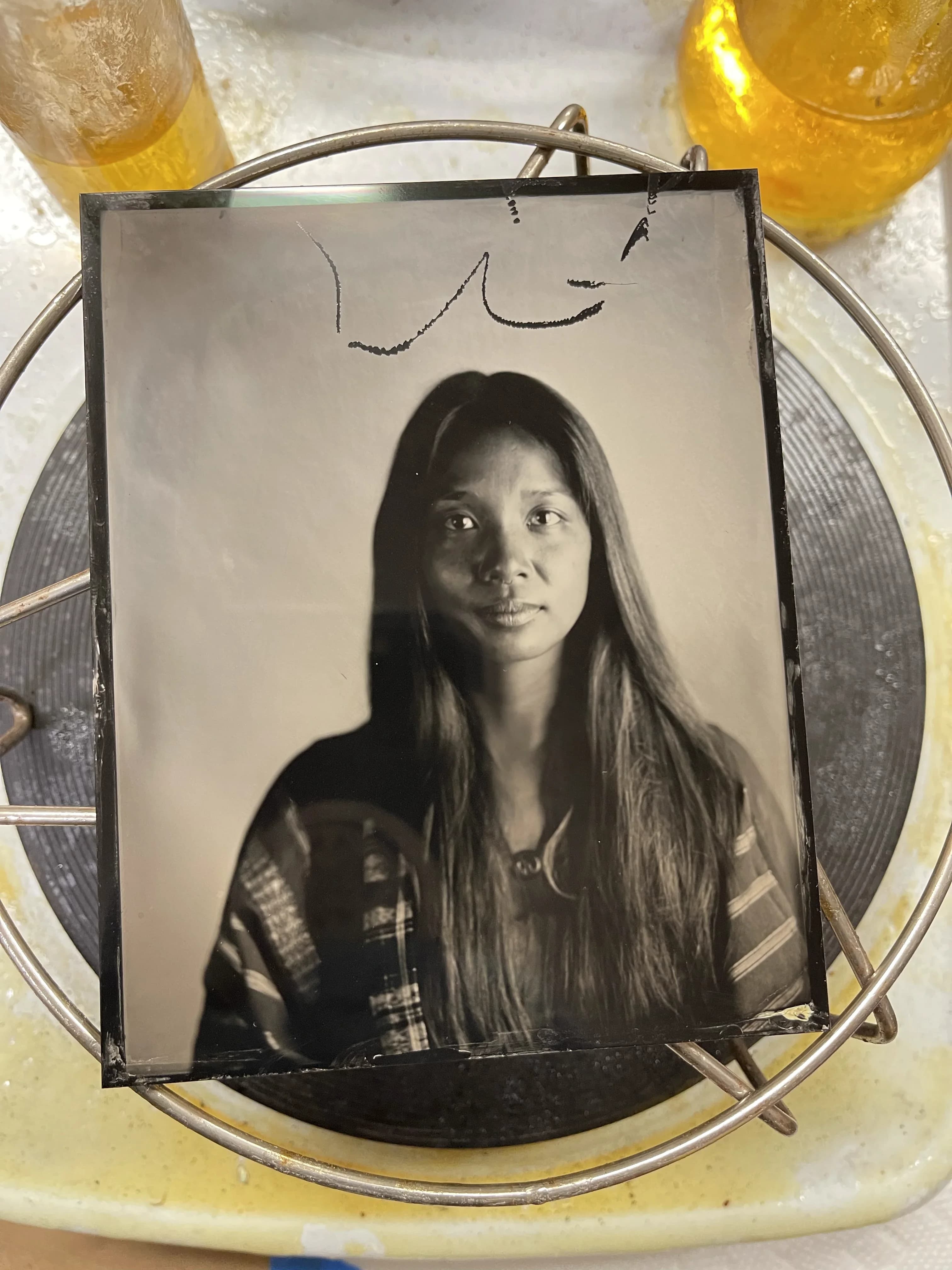 Tintype photograph of woven form in deep shadow
