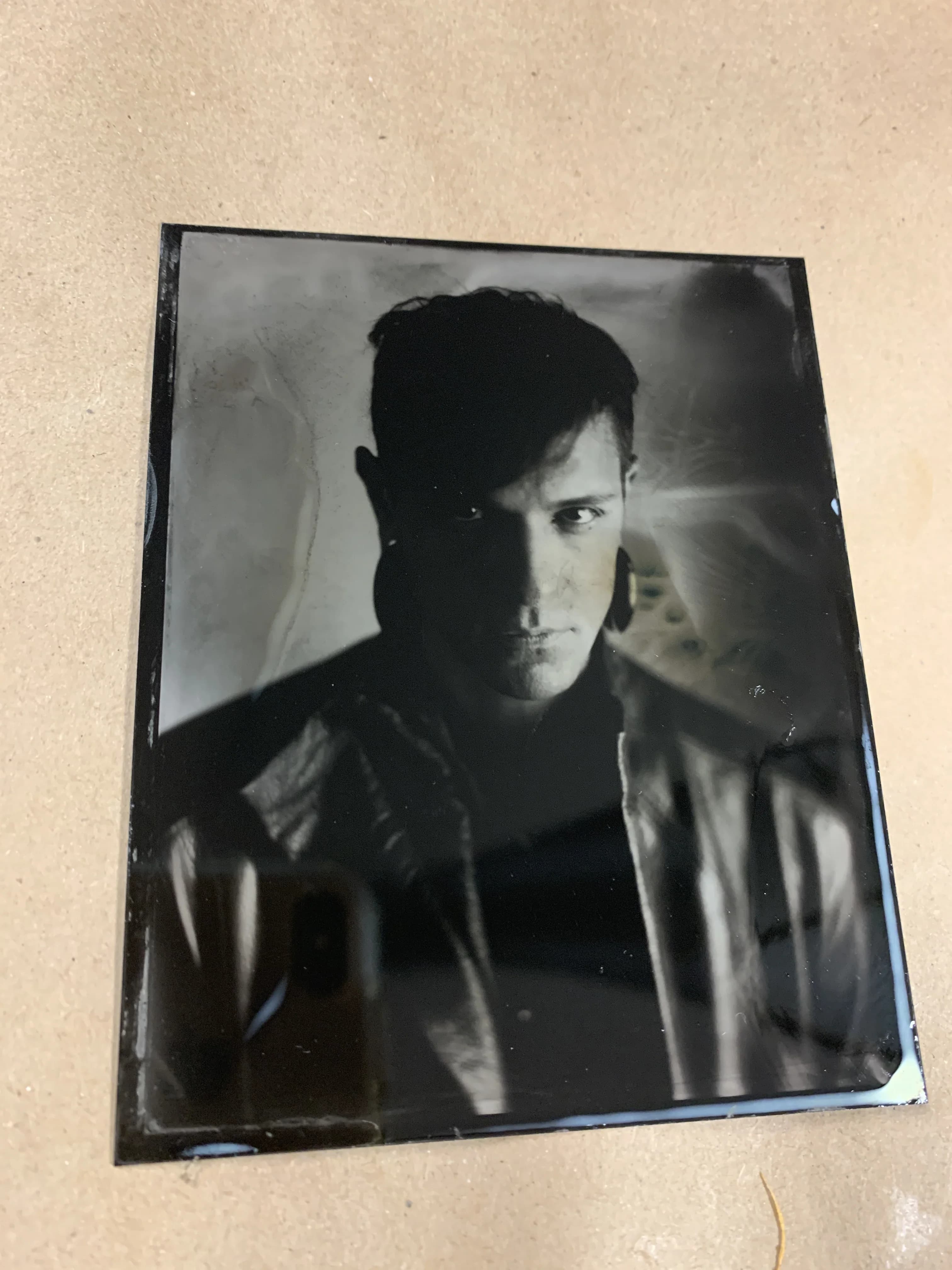 Tintype photograph of handwoven sculpture, portrait orientation