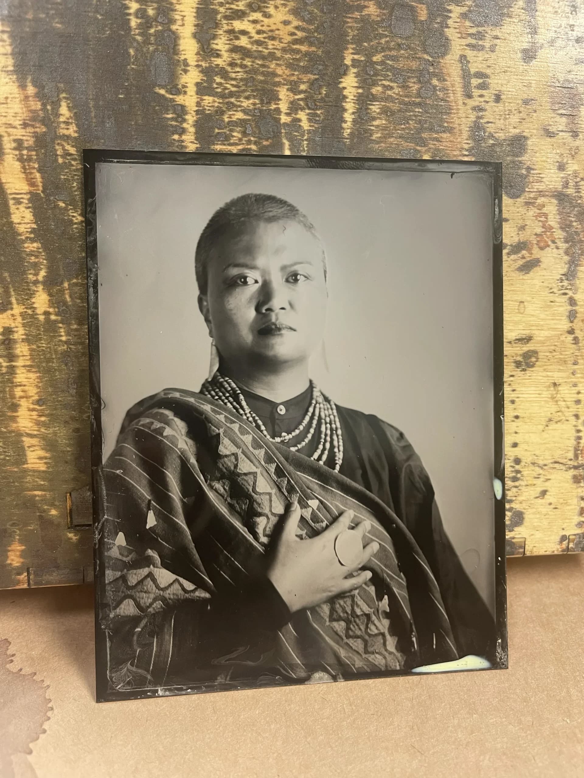 Tintype photograph of fiber form against dark ground