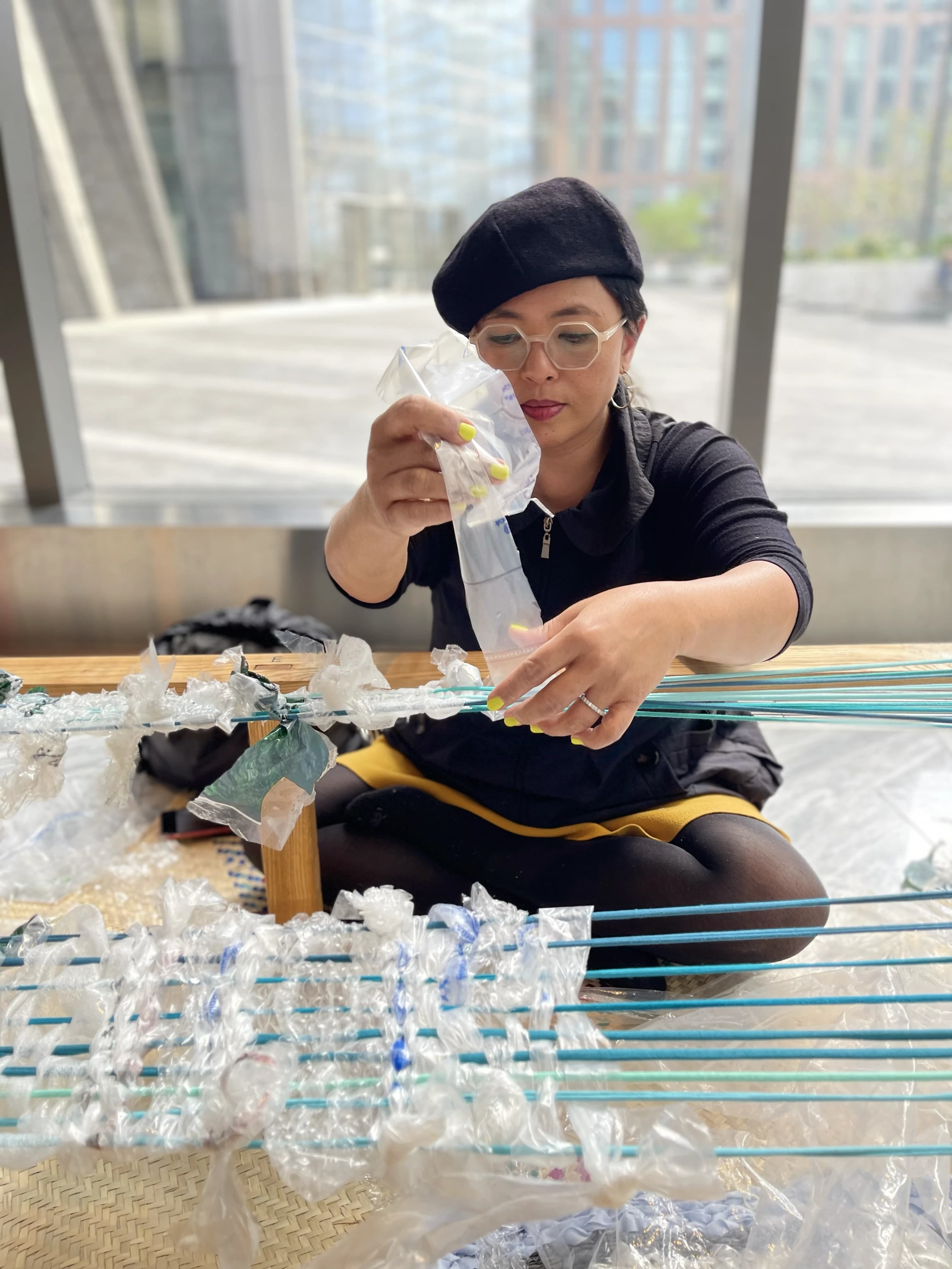 Participants weaving on Earth Day 2022